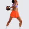 CRZ YOGA Mid Waisted Dolphin Athletic Shorts for Women 4" Lightweight High Split for Gym Workout with Liner Quick Dry
