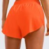 CRZ YOGA Mid Waisted Dolphin Athletic Shorts for Women 4" Lightweight High Split for Gym Workout with Liner Quick Dry